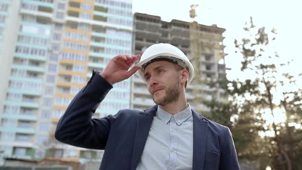 Portrait of an engineer in a construction helmet