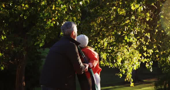 Girl lifted by dad outdoors