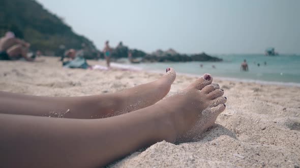 Woman Lies on Sand Beach Near Tropical Forest and Sea