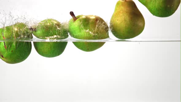 Super Slow Motion Pears Fall Into the Water with Air Bubbles