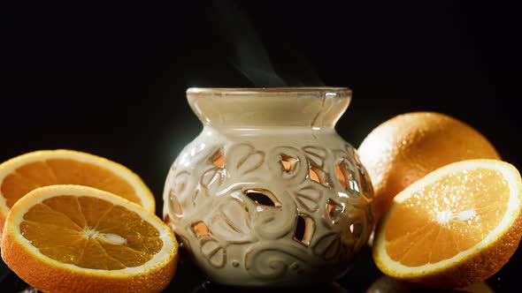 Candle Holder and Oranges Closeup