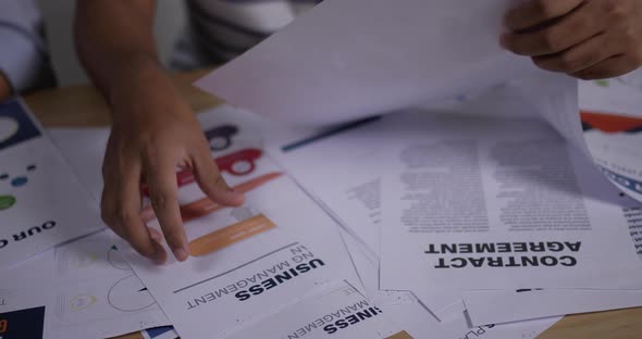 Close up docment of Asian young business people meeting in home office