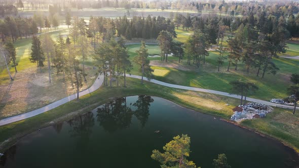 Flying over lakes, trees and countryside on a spring morning