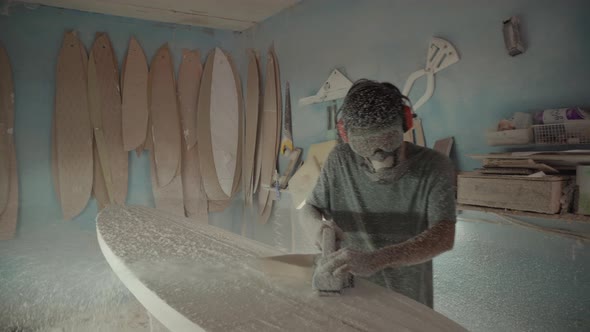 Asian Artisan Polishing Handmade Surfboard