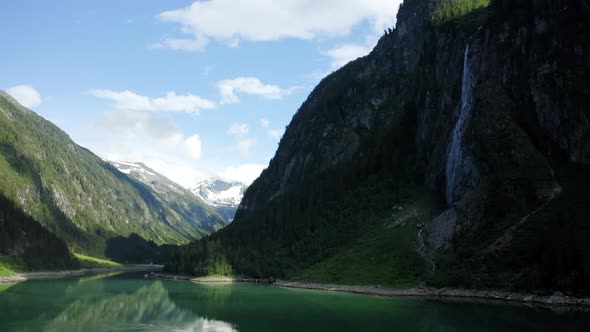 Aerial View of Stillup Lake with Impressive Waterfall Austria Tyrol