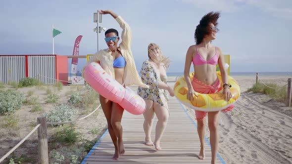 young women having fun on the beach