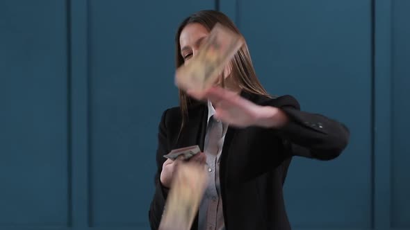 Young Happy Businesswoman Dancing and Throwing Money. Slow Motion. Successful Business or Winning