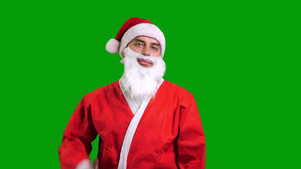 Santa Claus Smiling and Showing Thumbs Up on Green Chroma Key Background