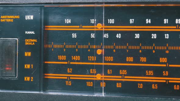 Tuning Analog Radio Dial Frequency on Scale of the Vintage Receiver