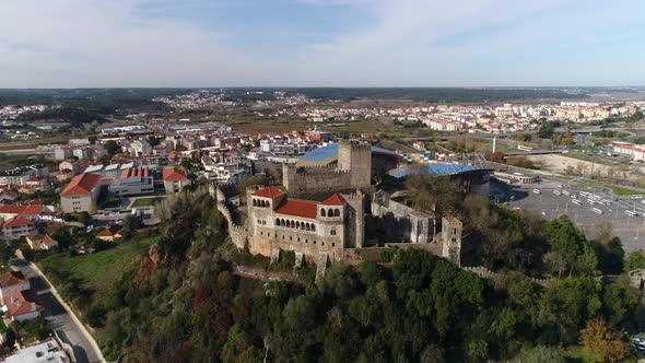 Leiria castle perched on hill and municipal stadium in background, Portugal