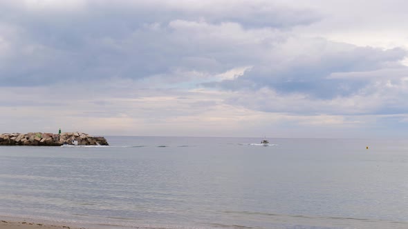 Boats Coming To The Beach After Cruising On The Coast Of Malaga In Spain. - wide, static