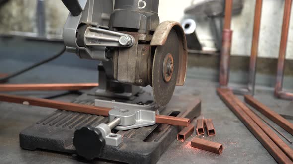 Worker Cuts Copper Profiles