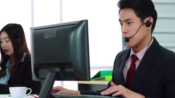 Business People Wearing Headset Working in Office