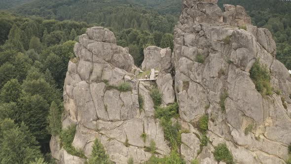 Closeup Ruined Castle at Mountain Spruce Forest Aerial