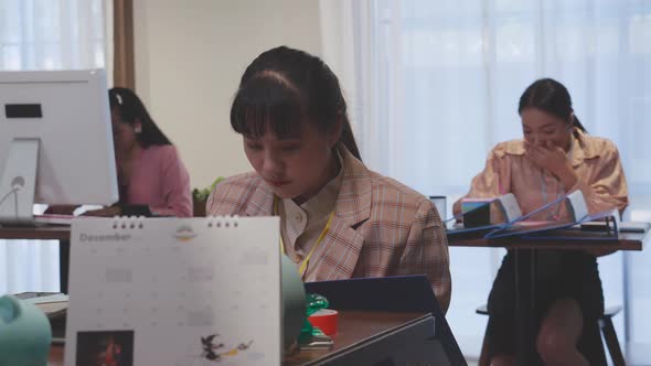 Young business woman is manager and employee working on laptop computer.