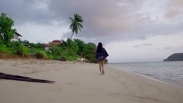 Cute Asian Girl in Kimono Walking on a Beach at Sunset in Slow Motion Thailand