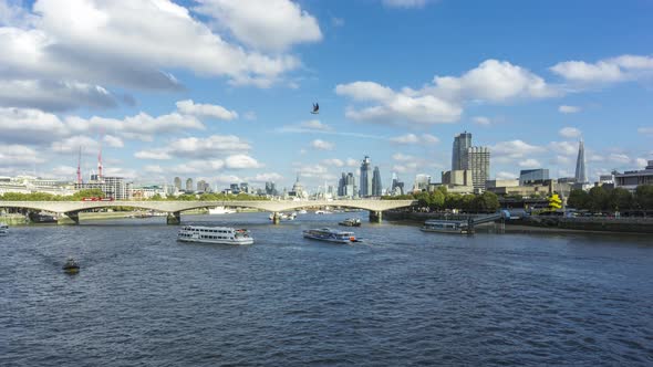 Panorama of City of London, Car Traffic on Waterloo Bridge, boats sail on Thames River