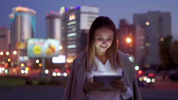 Attractive Girl with a Tablet