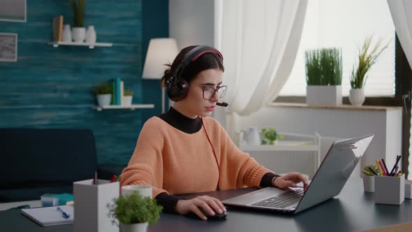 Student Talking on Online Class Video Call with Headphones alt