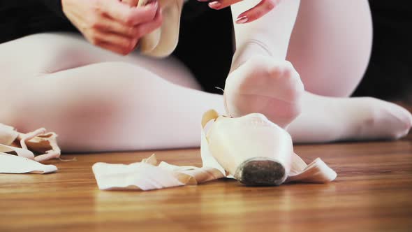 Caucasian Girl Ballerina in Black Tutu Dress Pointe Shoes on Her Feet