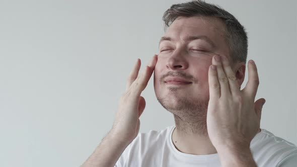 Male Cosmetics Facial Skin Care Man Applying Cream