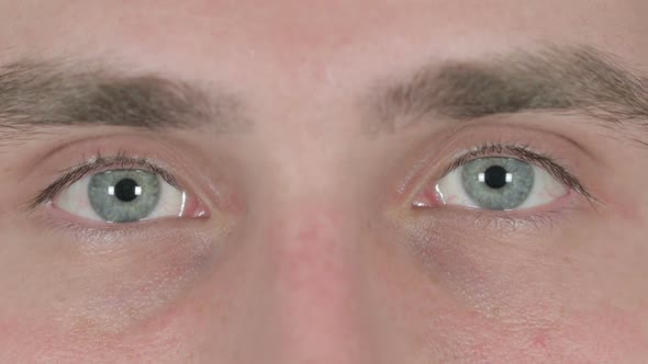 Close Up of Blinking Eyes of Young Man