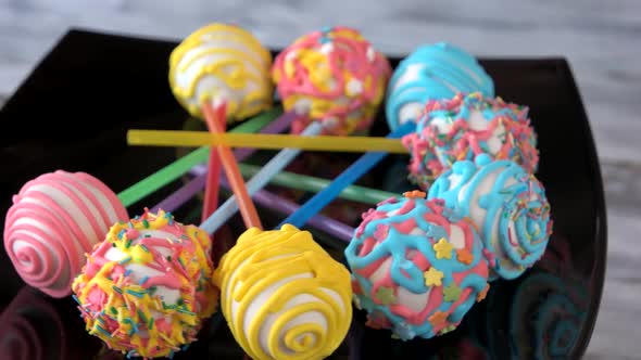 Cake Balls with Sticks on Plate