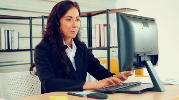 Business People Wearing Headset Working in Office