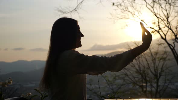 Woman Photographs Herself on the Phone