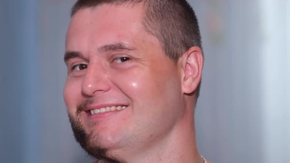 Man's Face Close Up Showing Cheerful Emotions on Camera