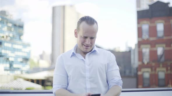 Man using smart phone outdoors