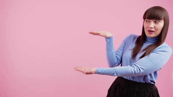 Medium Studio Shot of Young Caucasian Brunette Woman Wearing Violet Turtleneck Showing Copy Space