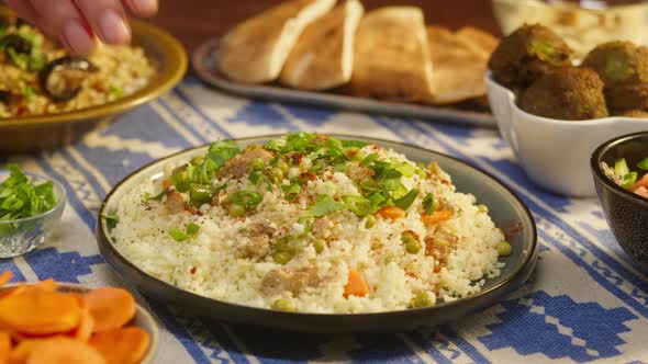 Eating Couscous with Chicken on Table Closeup