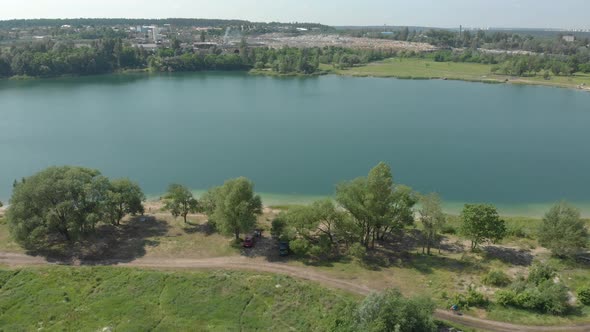 Lake And Poppy Flower Field