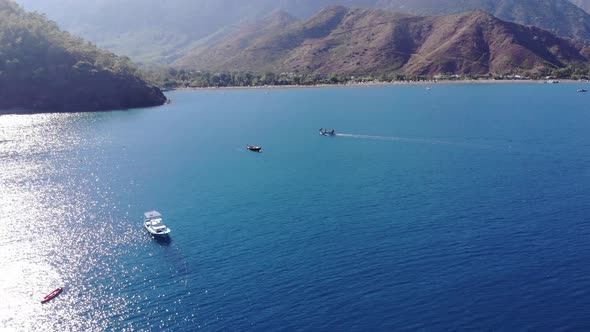 Stunning Aerial View of the Bay of the Sea with Sparkling Blue Water From the Sun Surrounded By