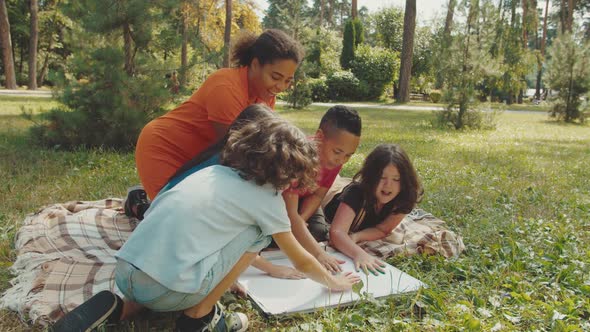 School Children Creativity During Outdoor Lesson in Public Park