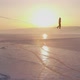 The Tightrope Walker Is Balancing on a Rope Between Two Rocks Above a Frozen Lake - VideoHive Item for Sale