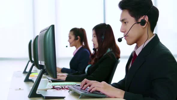 Business People Wearing Headset Working in Office