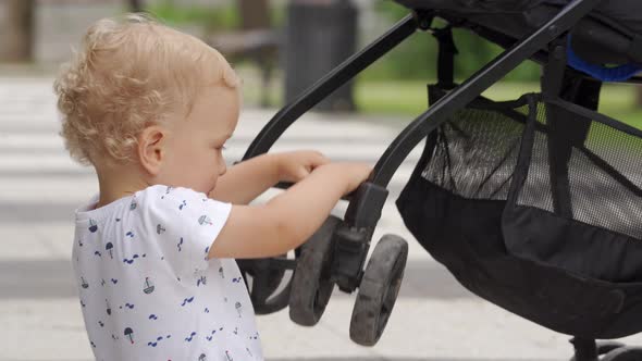 Mother and Little Child Walk in the Park in Summer Happy Kid Having Fun Playing on Footpath with