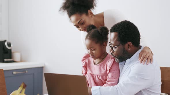 Positive parents talking something to daughter