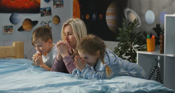 Mother and Children Praying Together