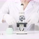 Dermatologist Works with Microscope Researching Plantbased Skin Care Product - VideoHive Item for Sale