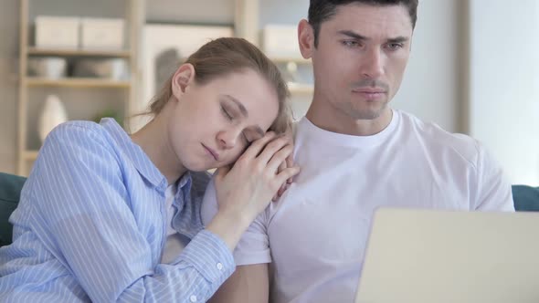 Man Using Laptop Sleeping Girlfriend Shoulder