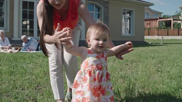 Toddler Girl Making First Steps