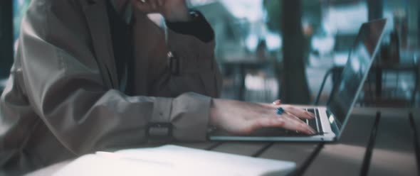 Young professional woman typing and working on her computer