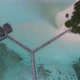 Aerial 4K view of water bungalow on a Maldives island resort - VideoHive Item for Sale