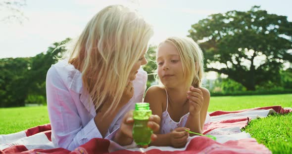 Mother and Daughter Relaxing in Park