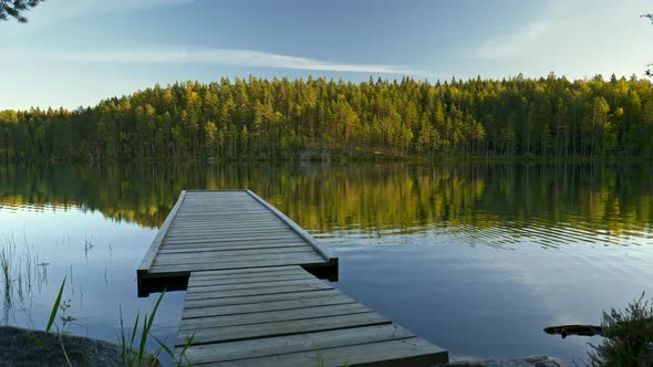 Pier in Repovesi National Park, Kouvola, Finland. Steadicam Shot of Pier and Lake with Reflections