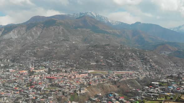 Aerial View Of Muzaffarabad City Of Azad Kashmir In Pakistan. Dolly Forward