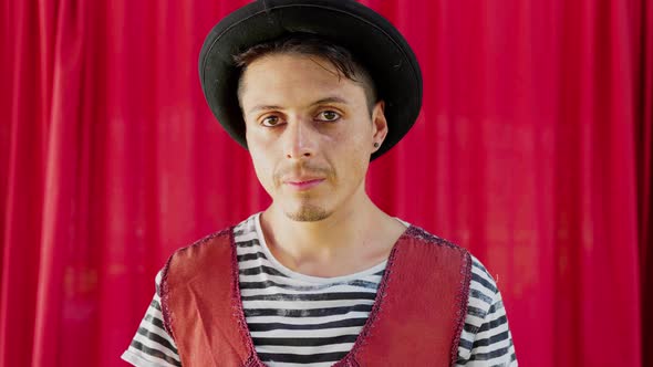 Portrait of serious circus artist with hat